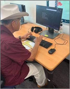 Beginning Literacy Student Felipe Porcayo practicing typing